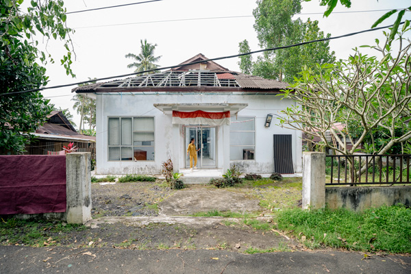 Building with woman in front.