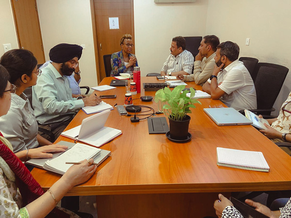 People around a table meeting.