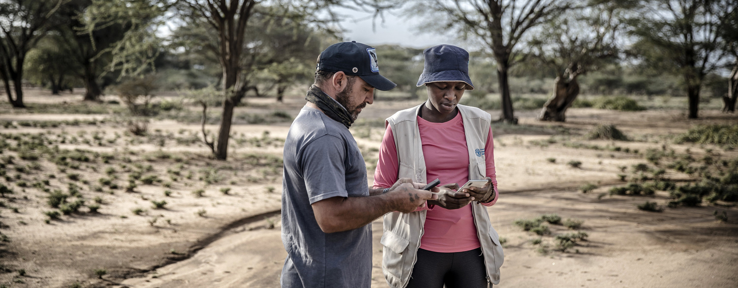© FAO/Luis Tato FAO Kenya use their mobile phones to enter coordinates on eLocust3 app